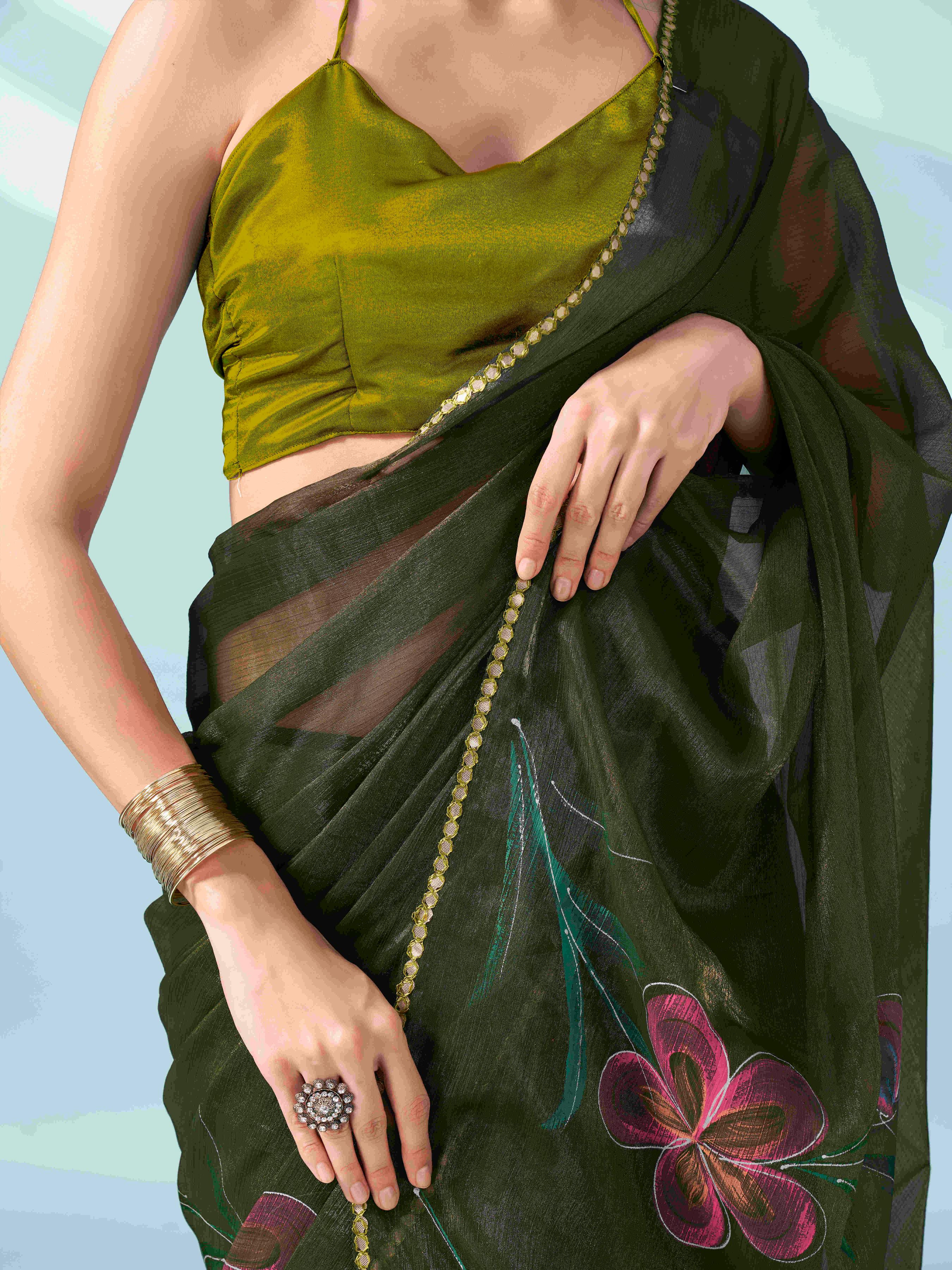 Green colored shimmer chiffon saree with hand print and scalloped border