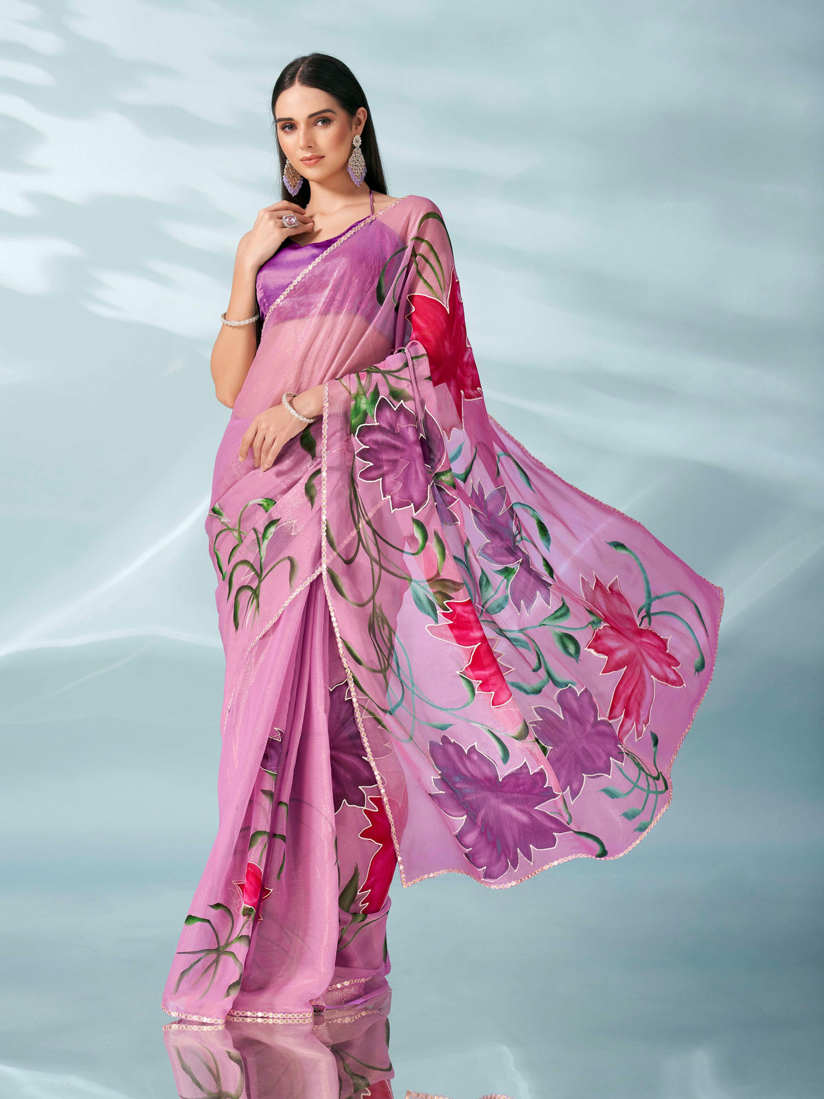 Pink colored shimmer chiffon saree with hand print and scalloped border