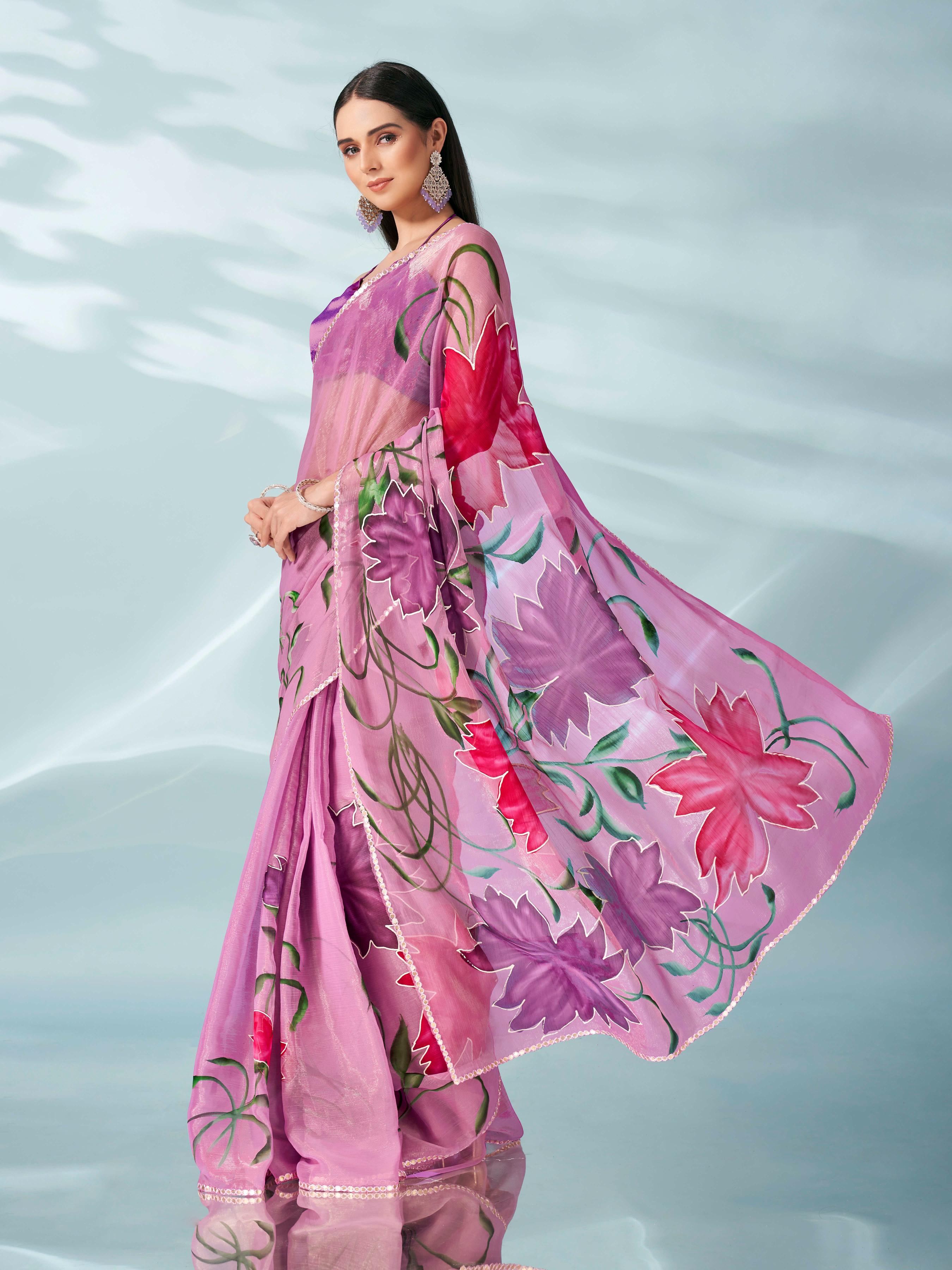 Pink colored shimmer chiffon saree with hand print and scalloped border