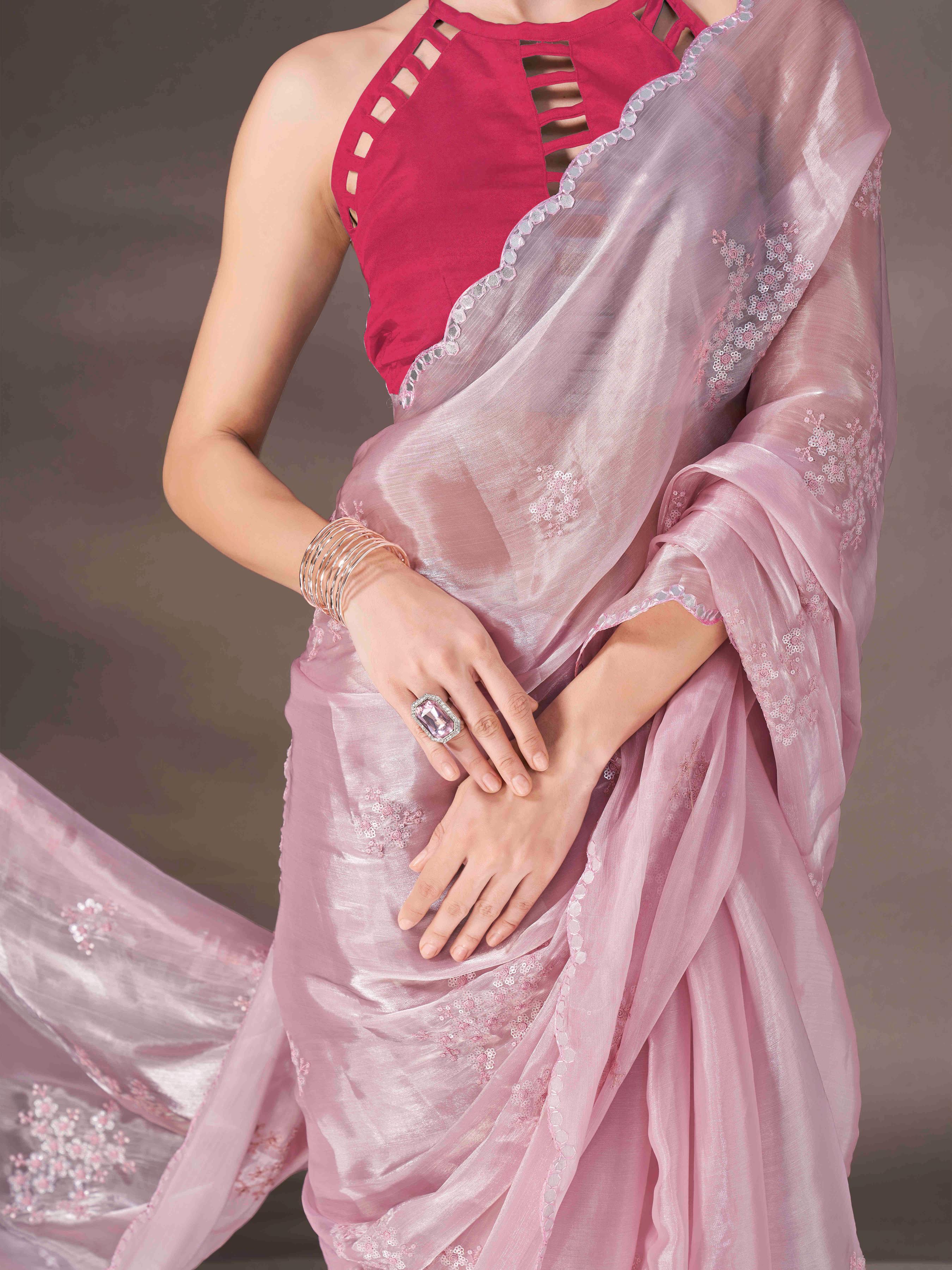 Baby pink colored shimmer satin saree with sequence embroidery and scalloped border