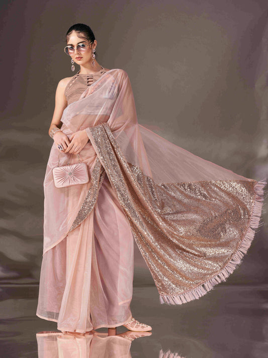 Beige colored shimmer net saree with sequin embroidery