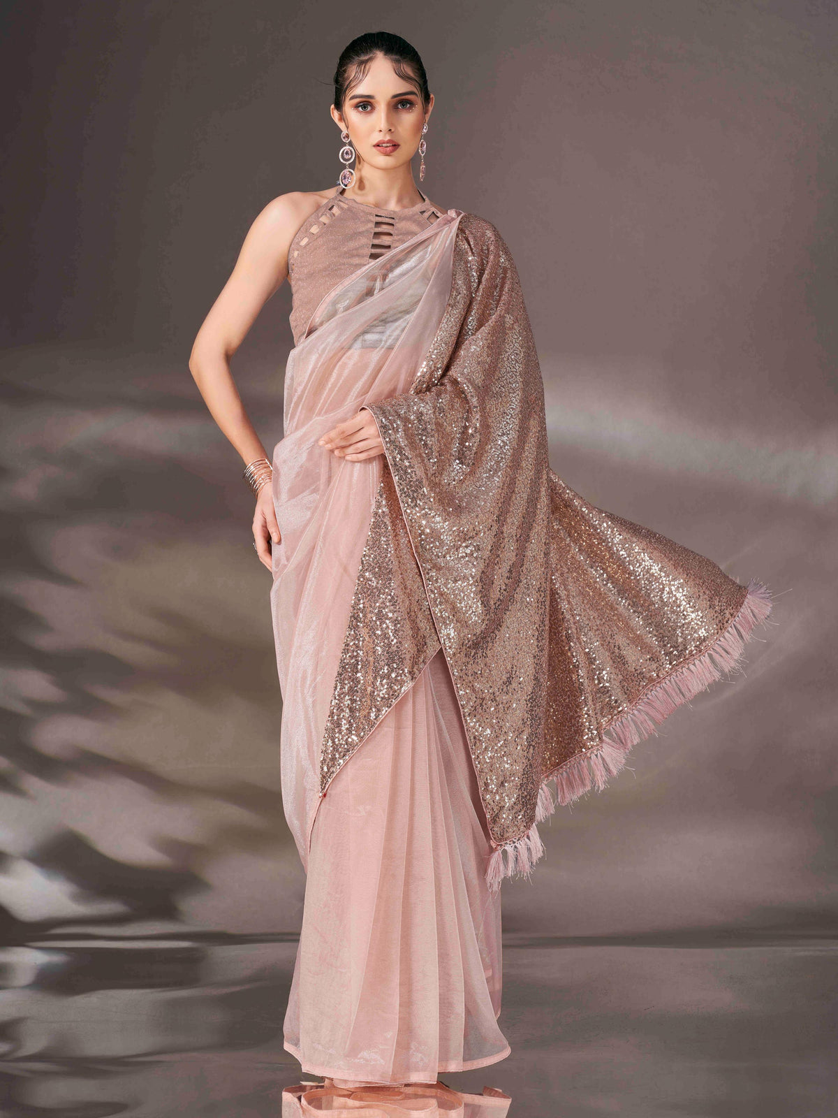 Beige colored shimmer net saree with sequin embroidery