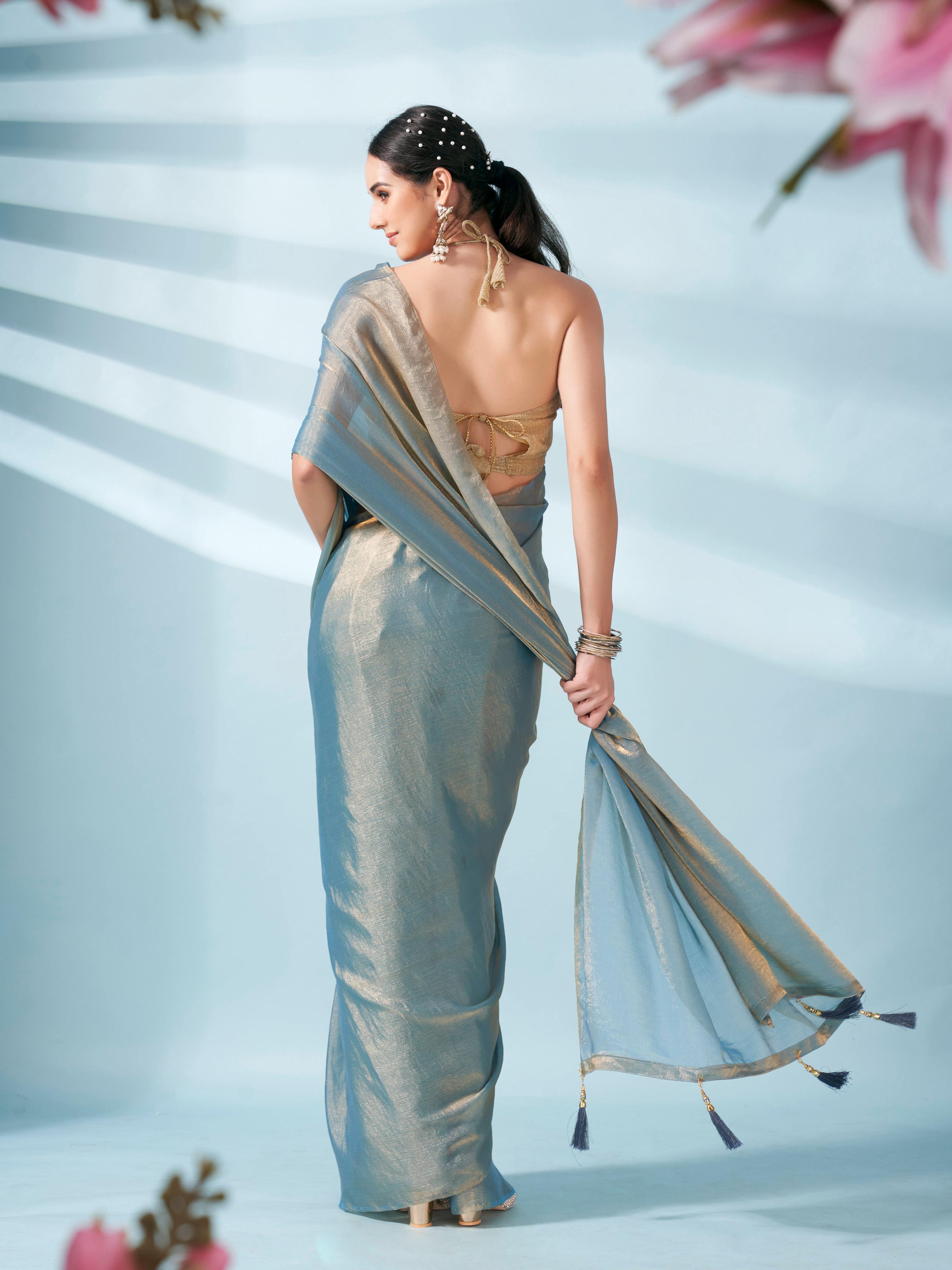 Blue and gold two tone shimmer chiffon saree with tassles in pallu and fancy lycra blouse