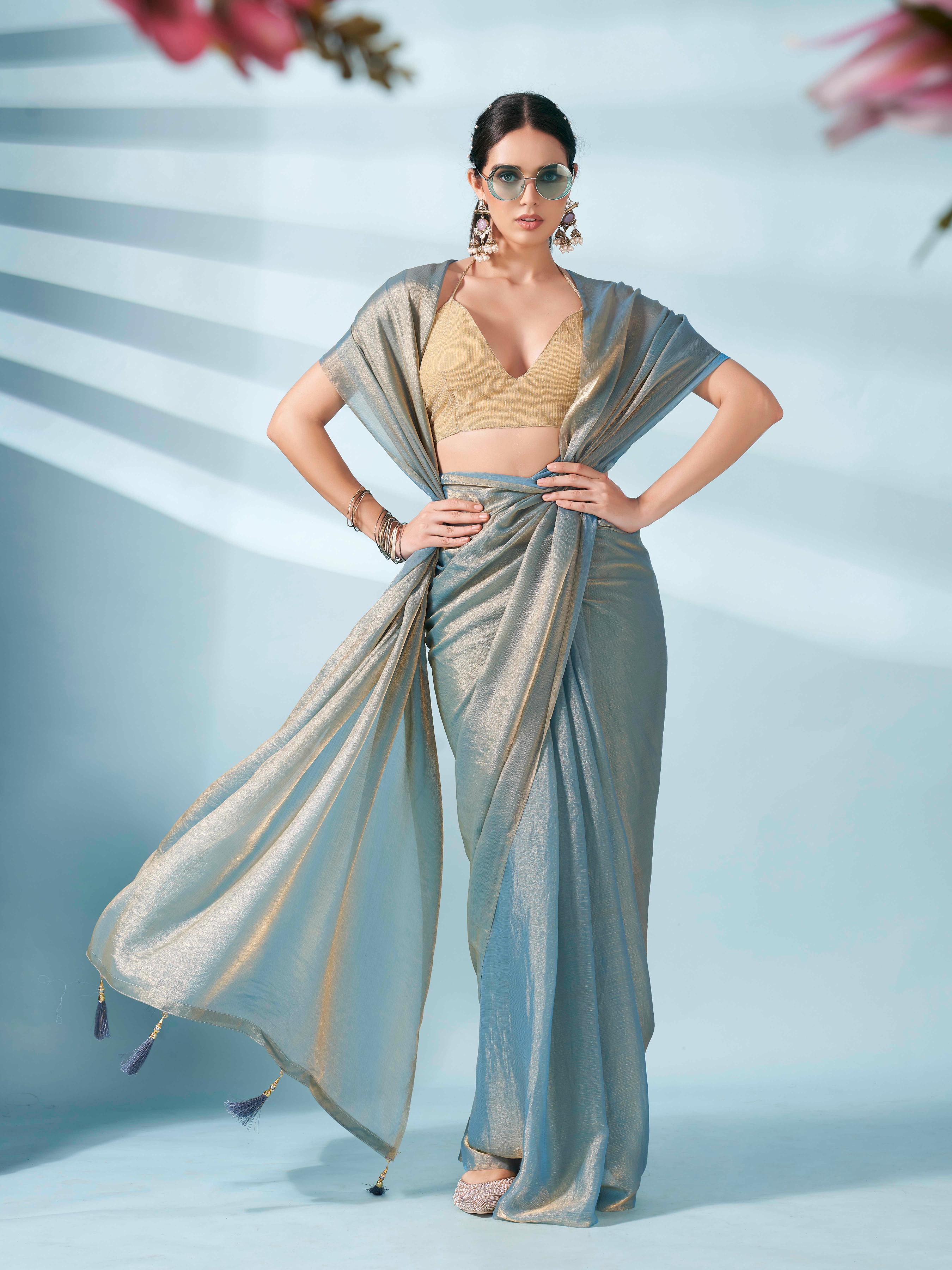 Blue and gold two tone shimmer chiffon saree with tassles in pallu and fancy lycra blouse