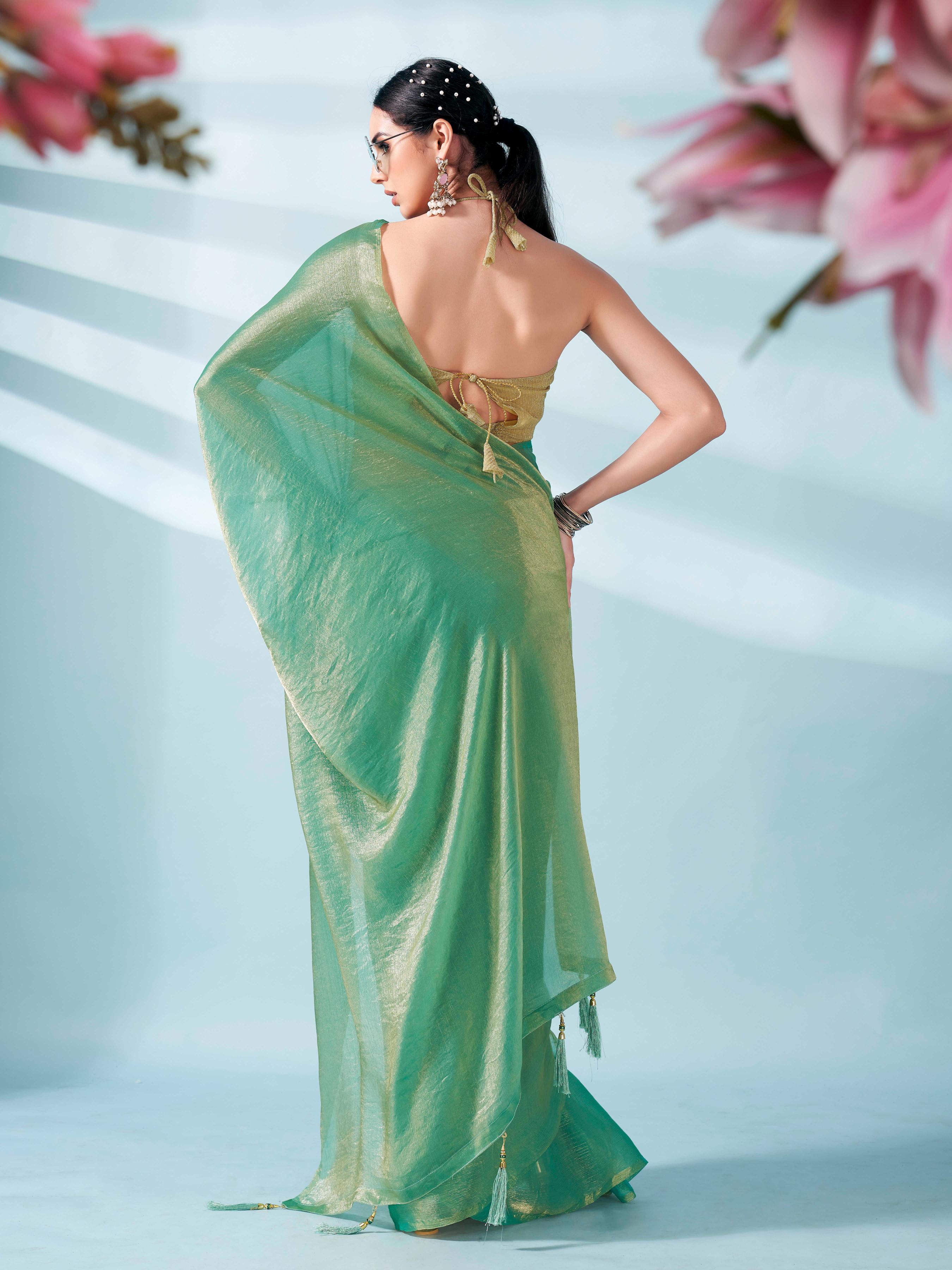 Sea green and gold two tone shimmer chiffon saree with tassles in pallu and fancy lycra blouse