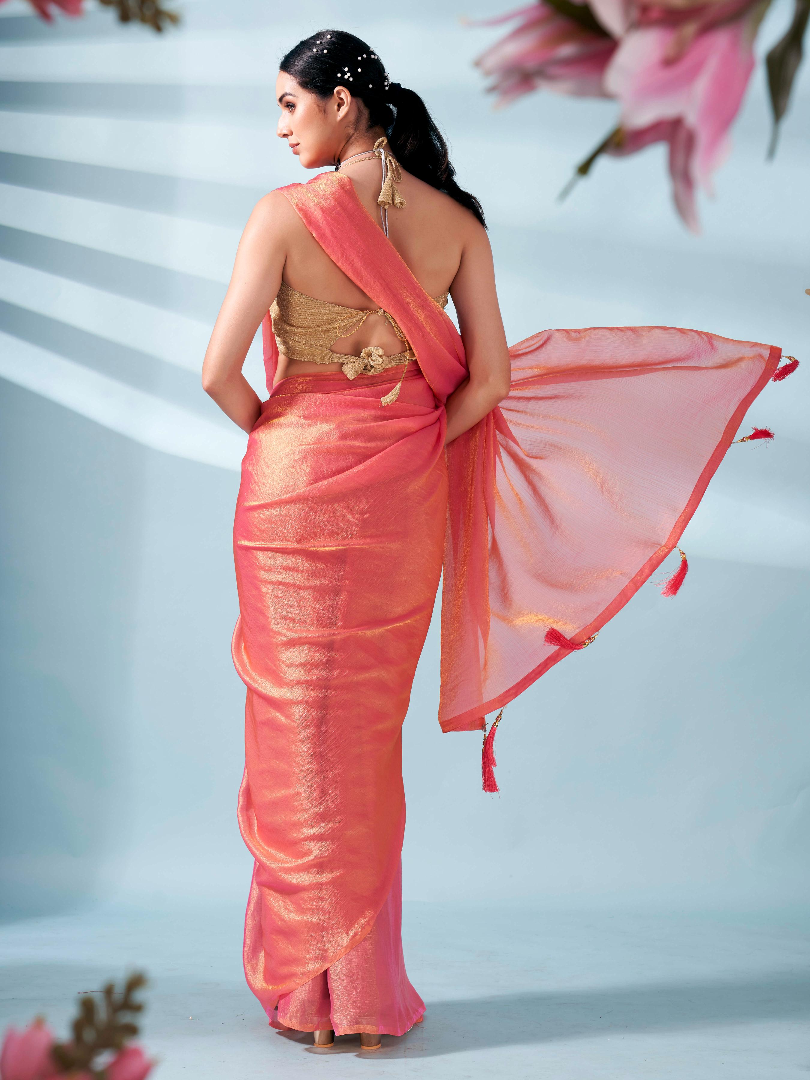 Pink and gold two tone shimmer chiffon saree with tassles in pallu and fancy lycra blouse