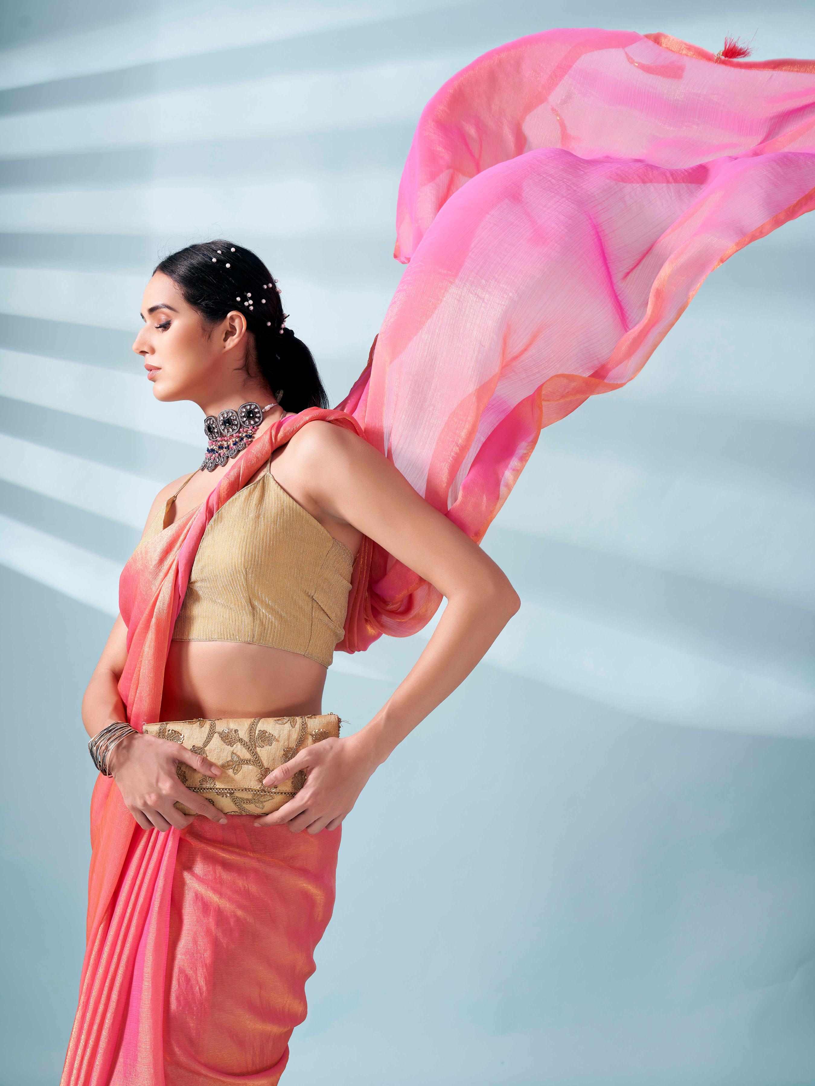 Pink and gold two tone shimmer chiffon saree with tassles in pallu and fancy lycra blouse