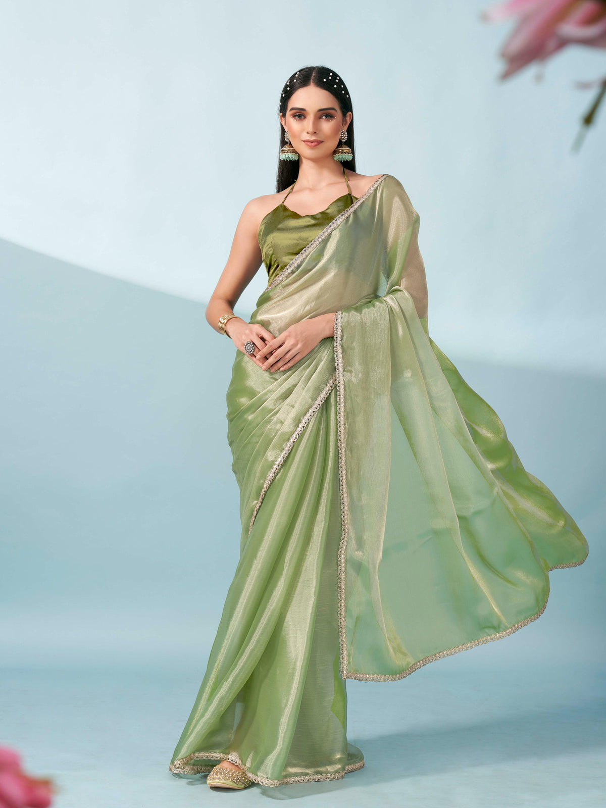 Green colored shimmer satin saree with embellished lace