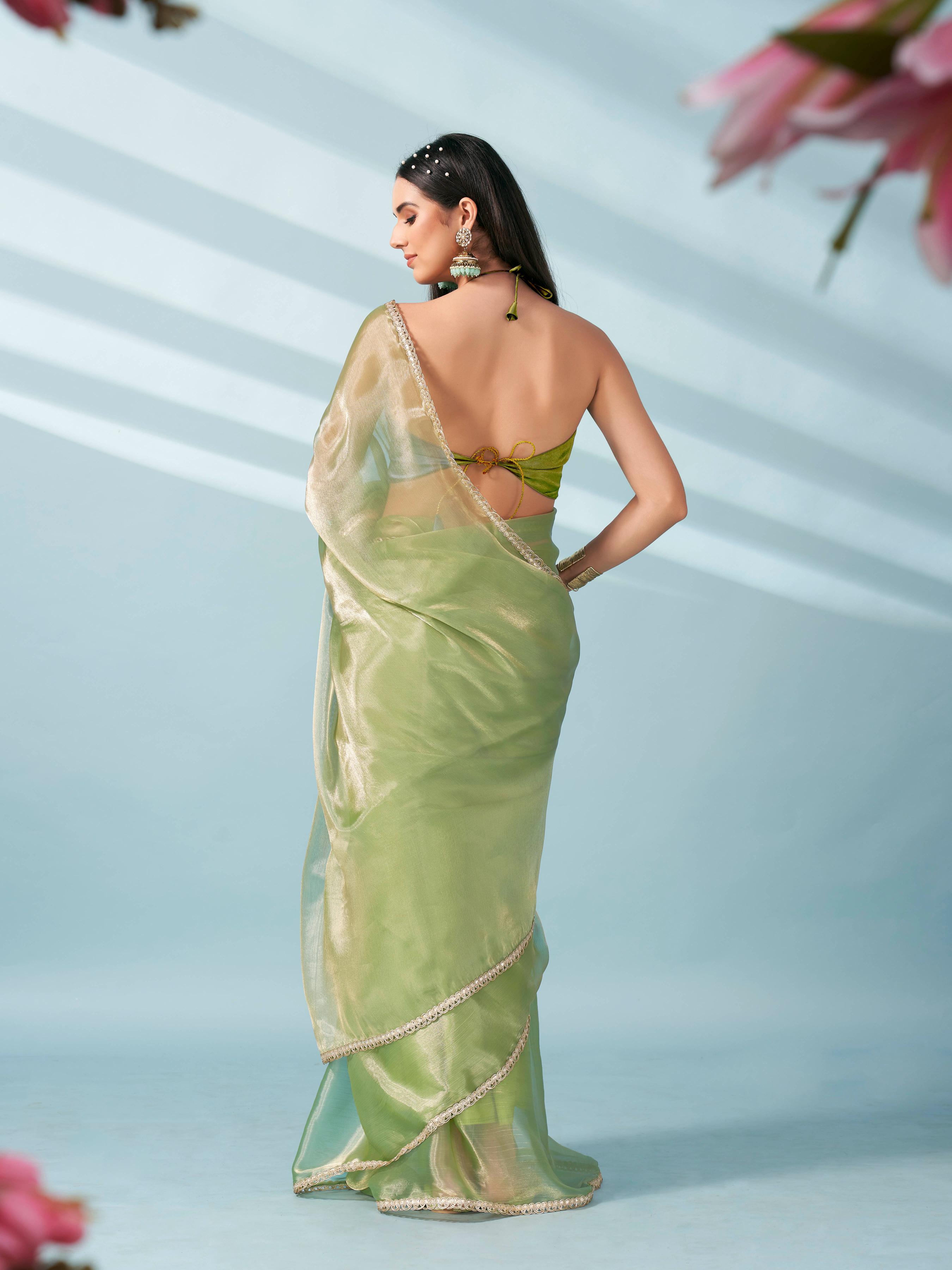 Green colored shimmer satin saree with embellished lace