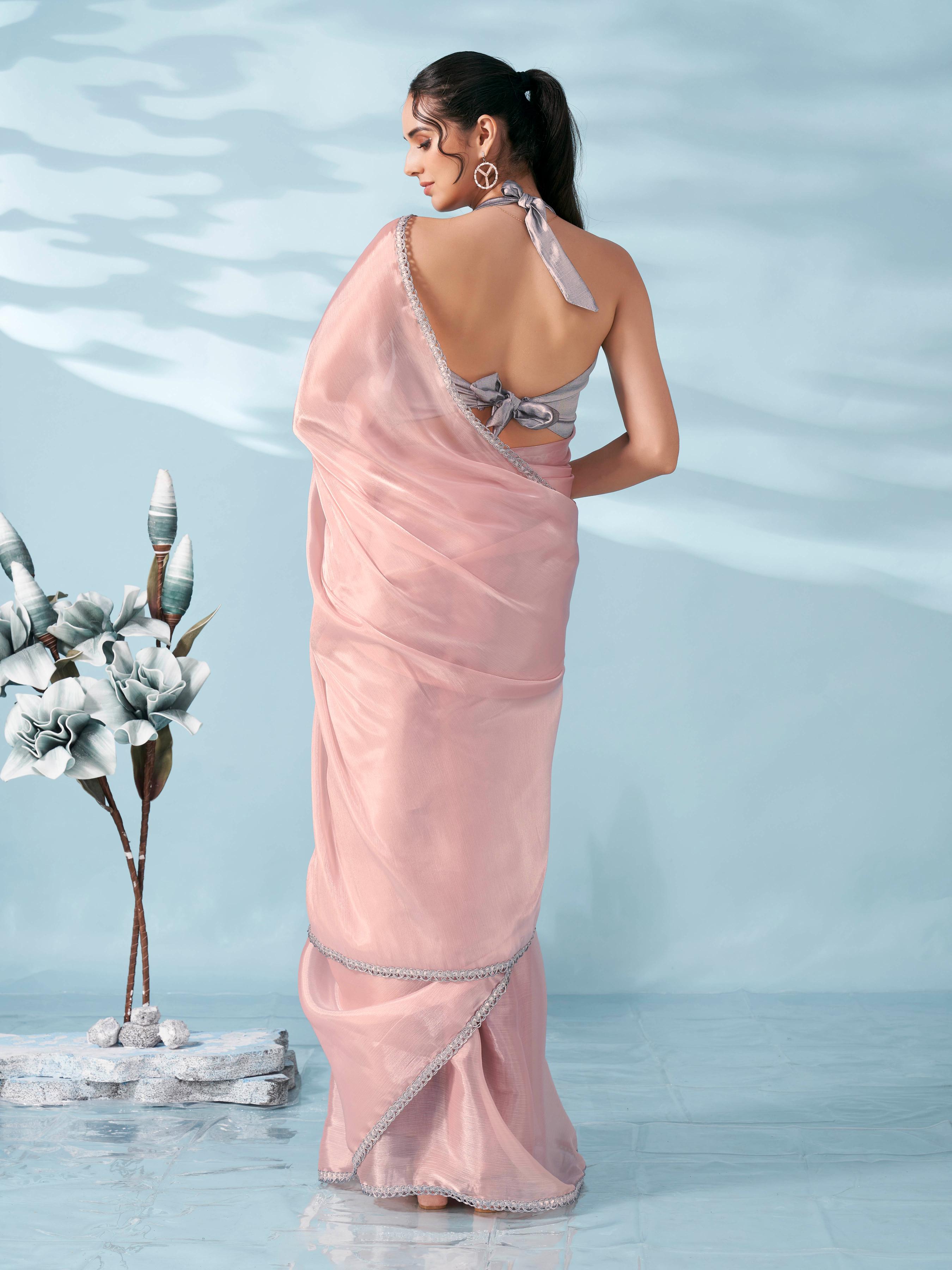 Peach colored shimmer satin saree with embellished lace