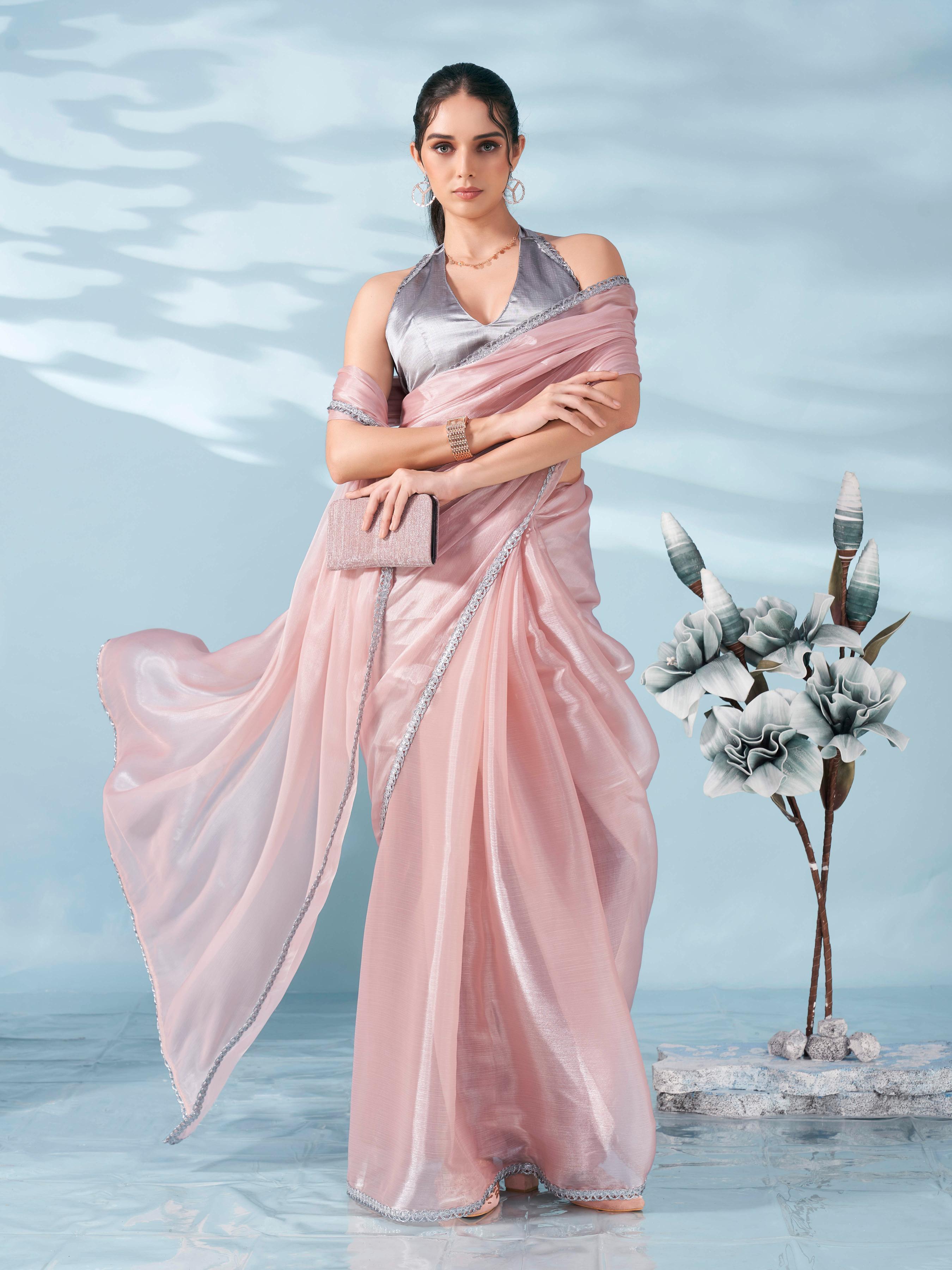 Peach colored shimmer satin saree with embellished lace