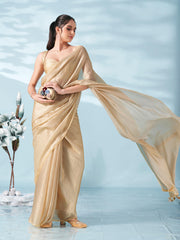 Beige colored satin saree with tassles on pallu