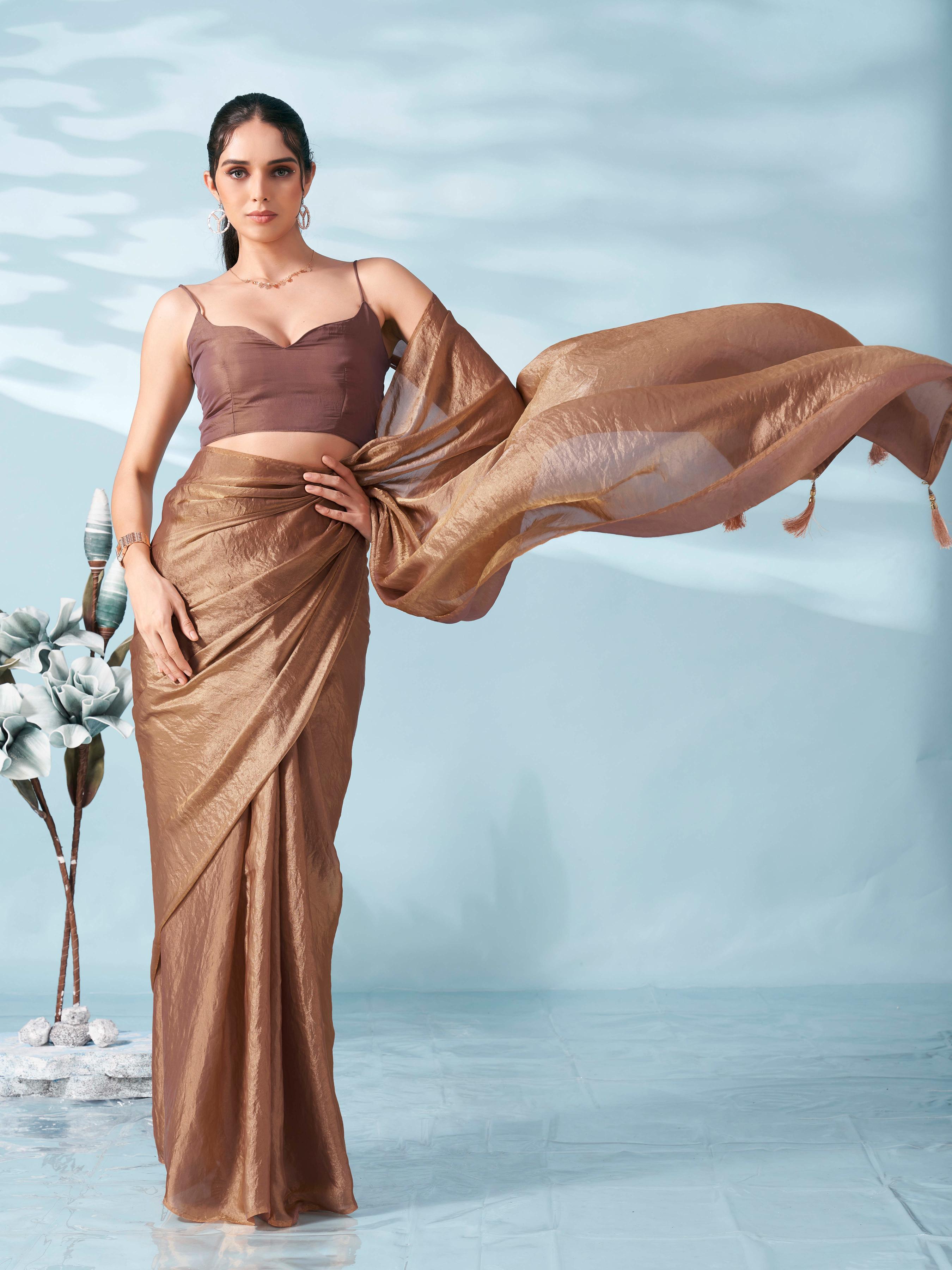 Two tone camel brown colored satin saree with tassles on pallu