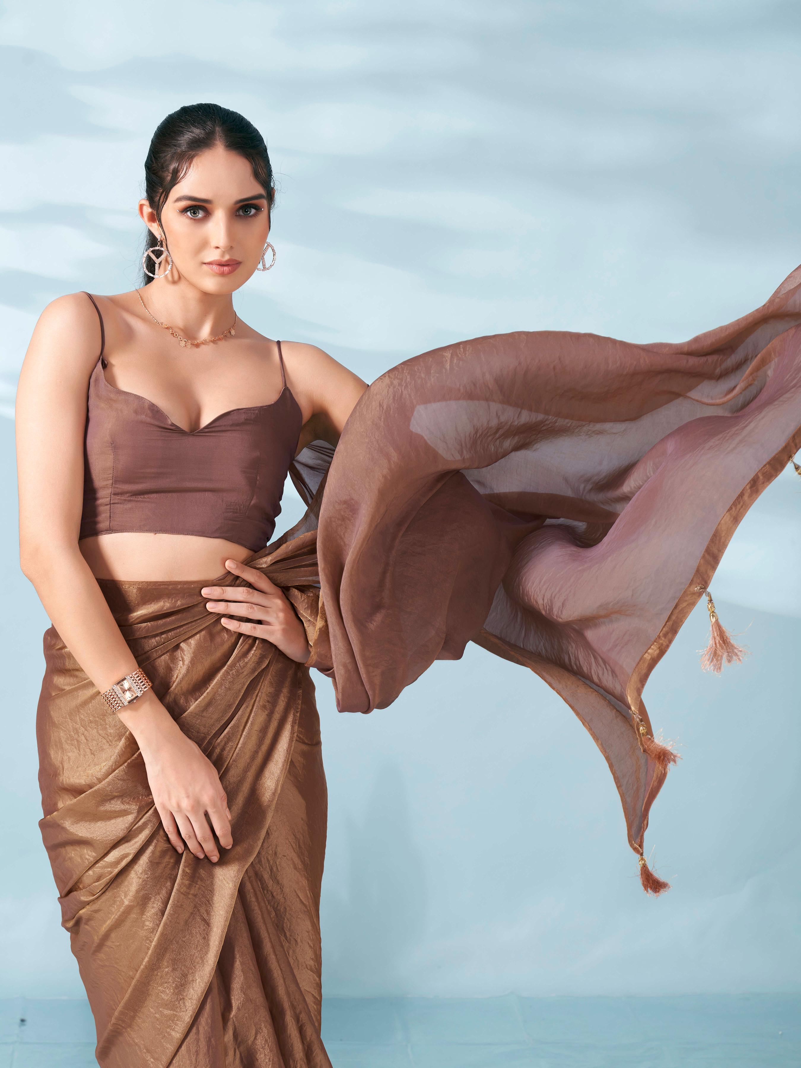 Two tone camel brown colored satin saree with tassles on pallu