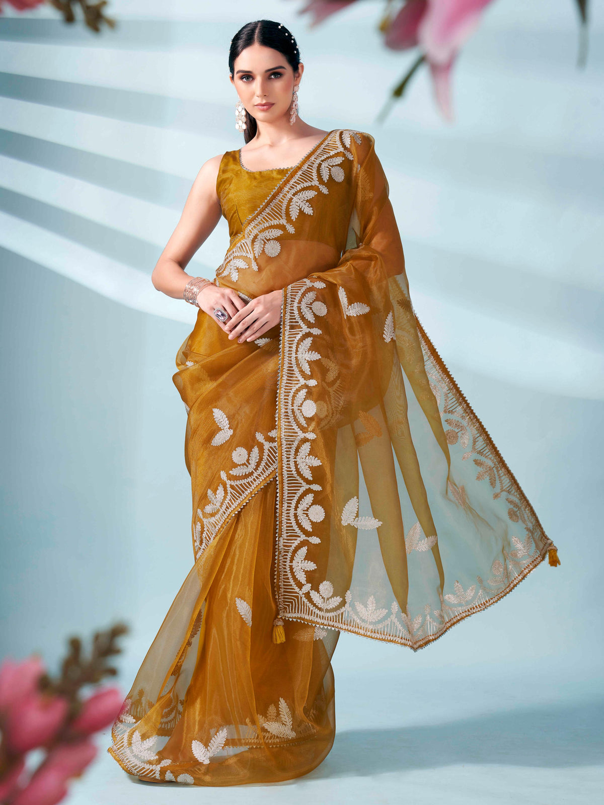 Mustard colored organza saree with gota patti embroidery and embellished border