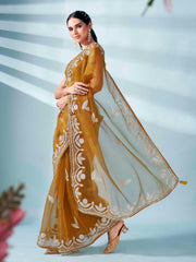 Mustard colored organza saree with gota patti embroidery and embellished border