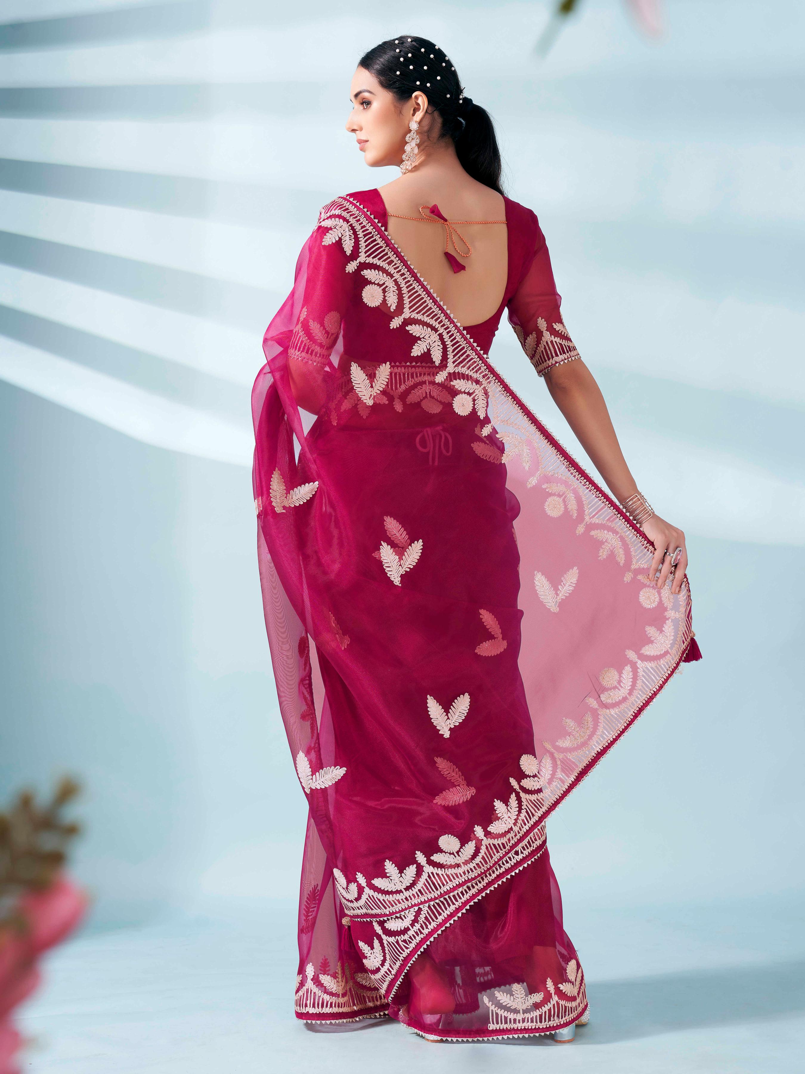 Burgundy colored organza saree with gota patti embroidery and embellished border