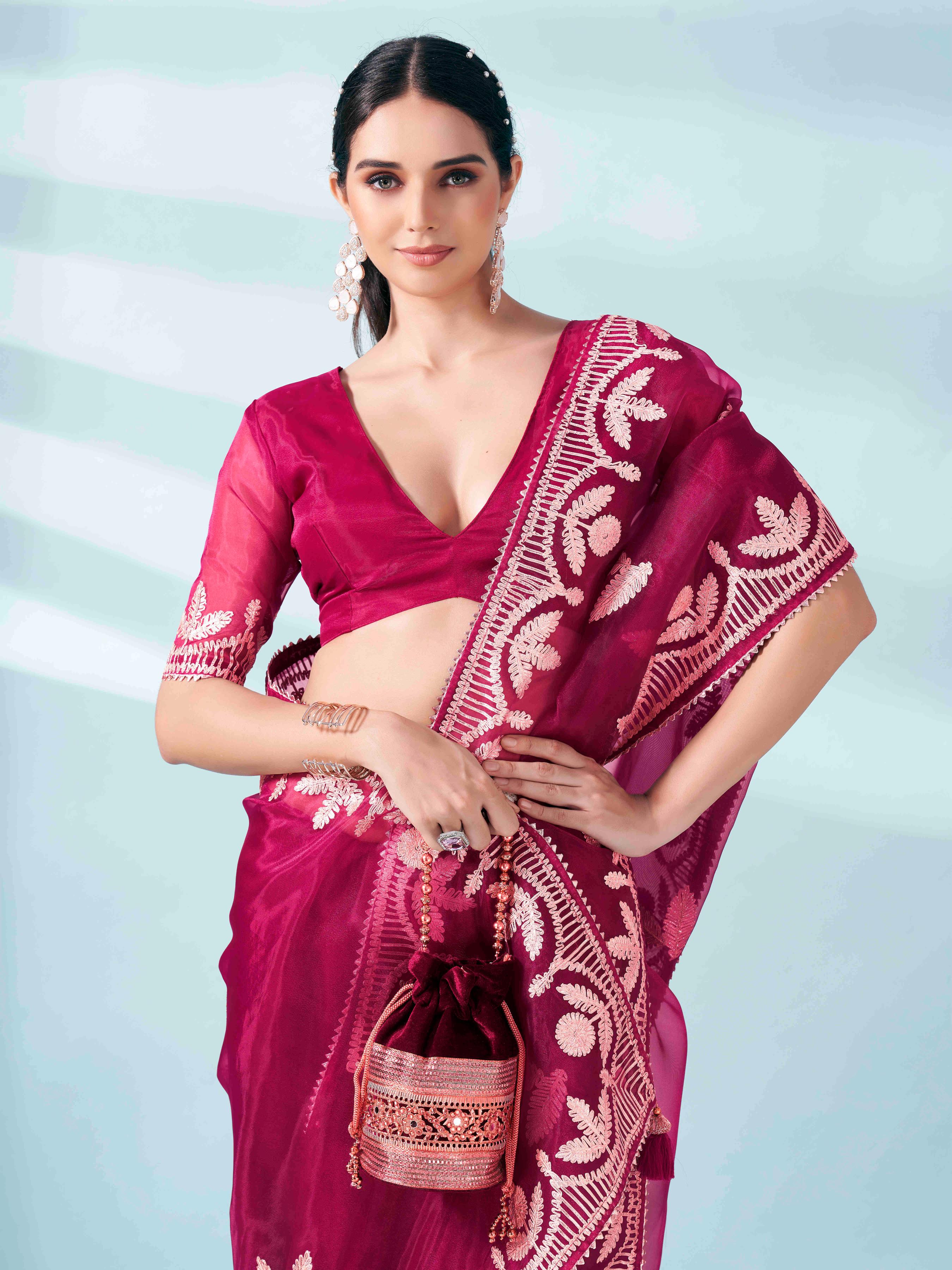 Burgundy colored organza saree with gota patti embroidery and embellished border