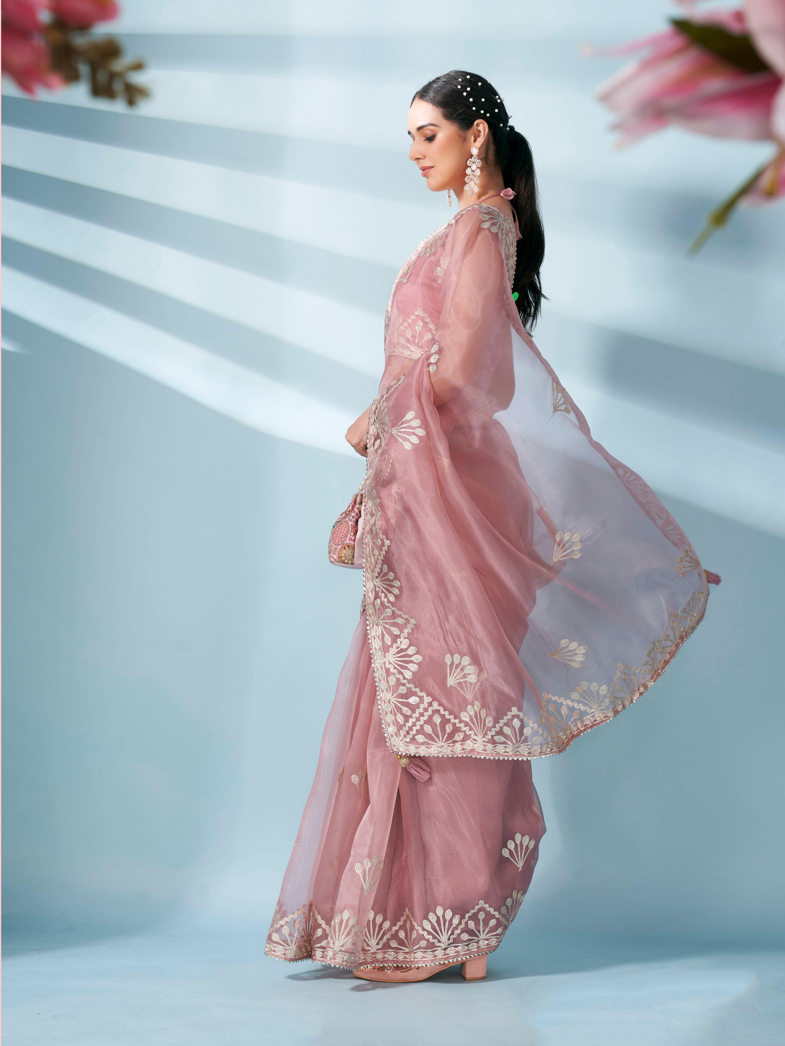 Peach colored organza saree with gota patti embroidery and embellished border