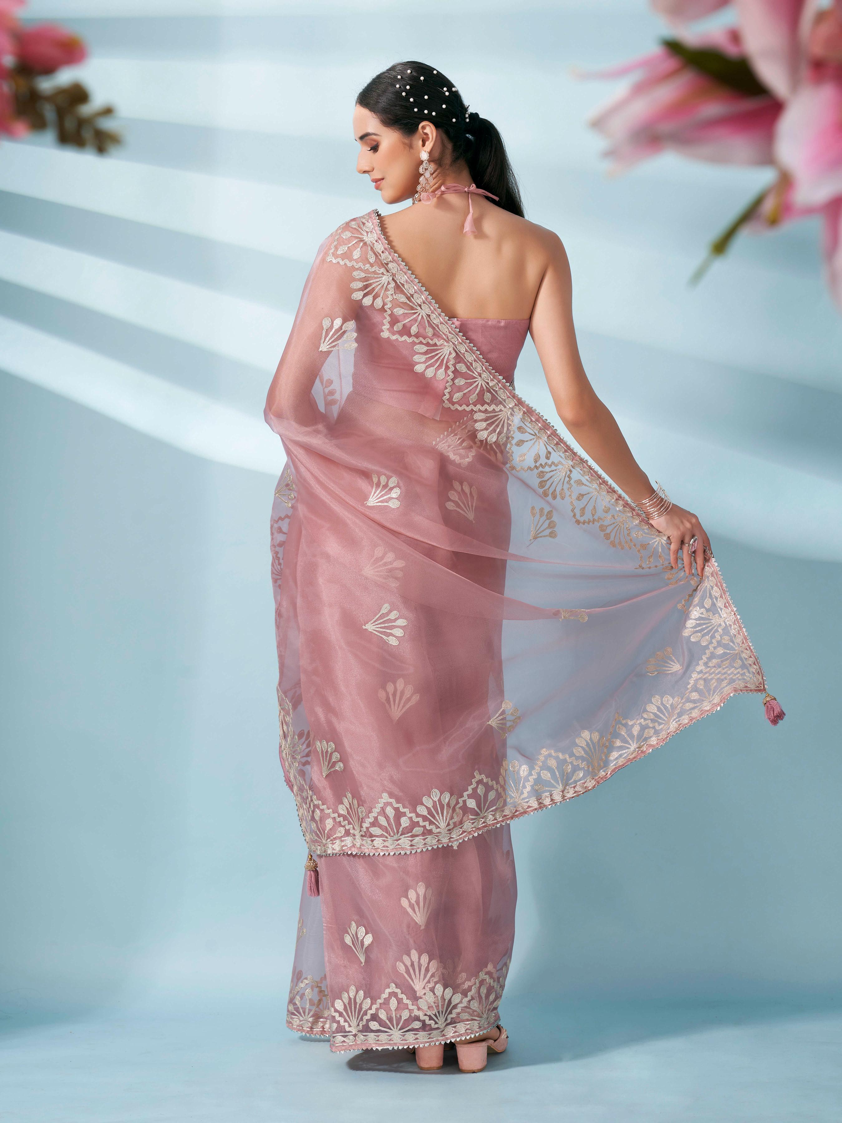 Peach colored organza saree with gota patti embroidery and embellished border