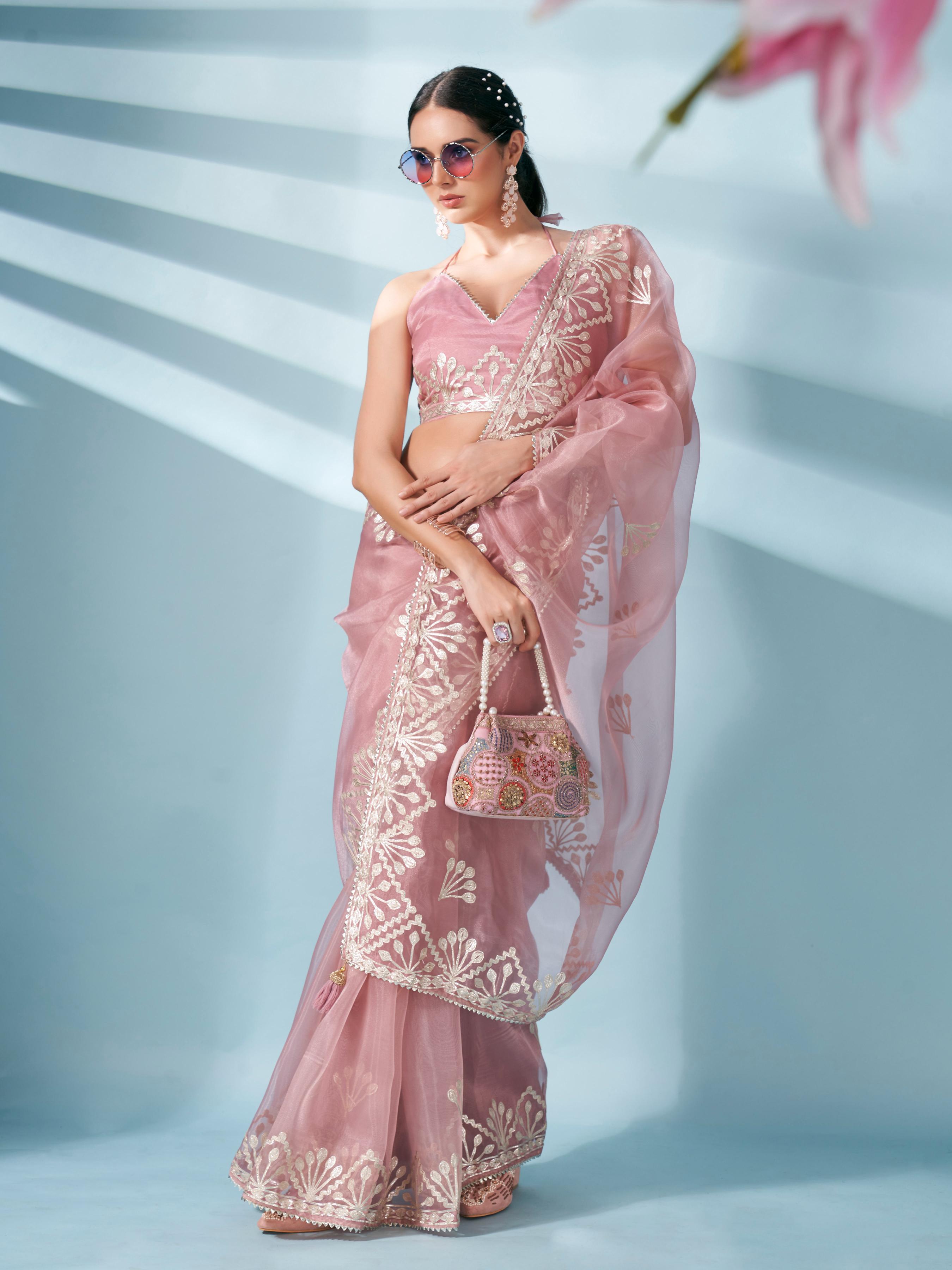 Peach colored organza saree with gota patti embroidery and embellished border