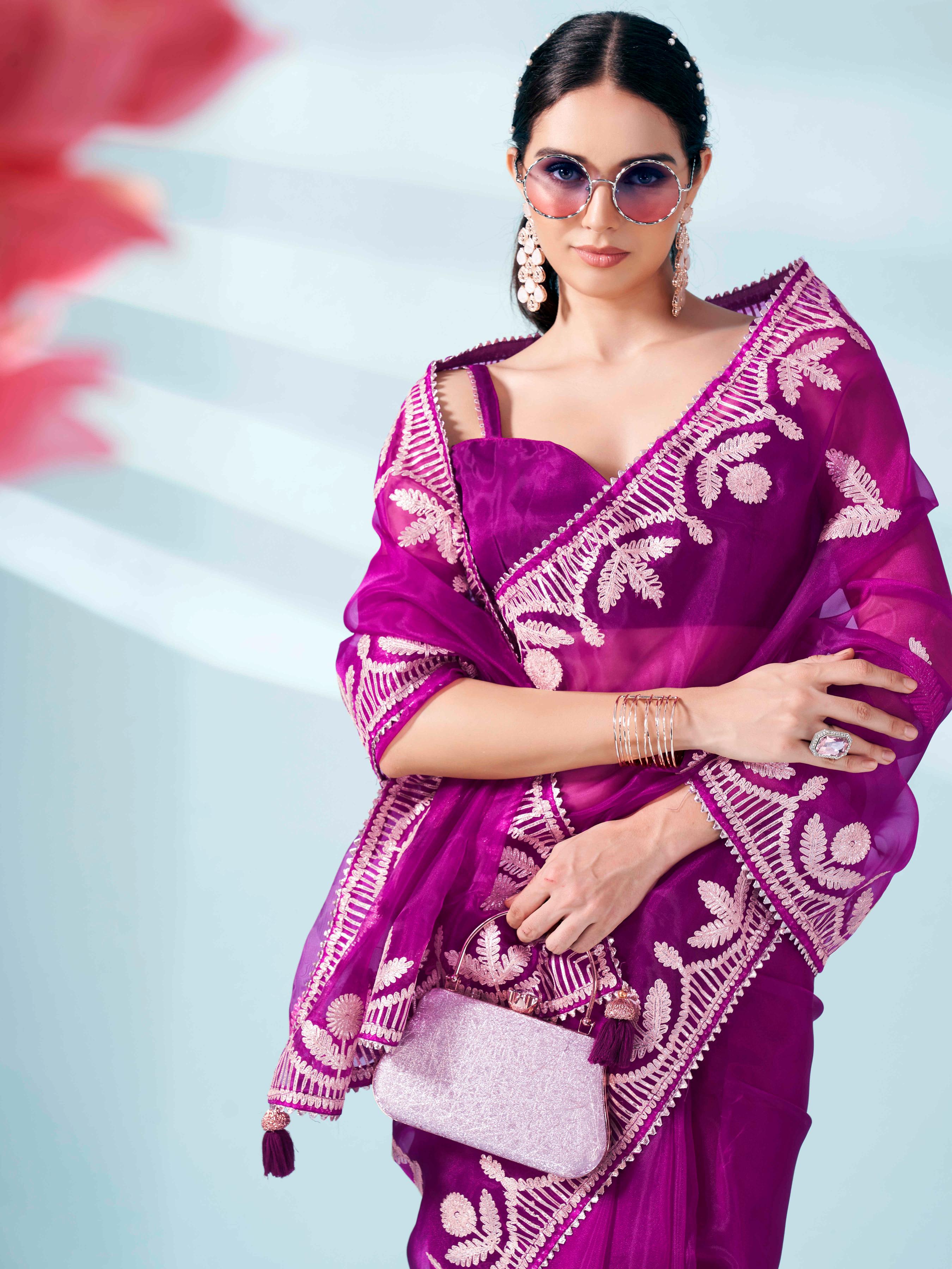 Magenta colored organza saree with gota patti embroidery and embellished border