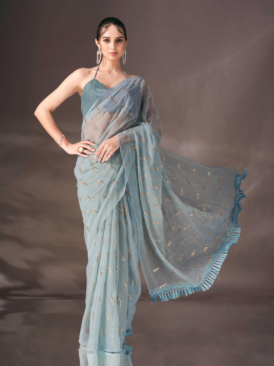 Blue colored sequin embroidered shimmer chiffon saree with tassles on pallu