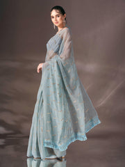 Blue colored sequin embroidered shimmer chiffon saree with tassles on pallu