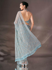 Blue colored sequin embroidered shimmer chiffon saree with tassles on pallu