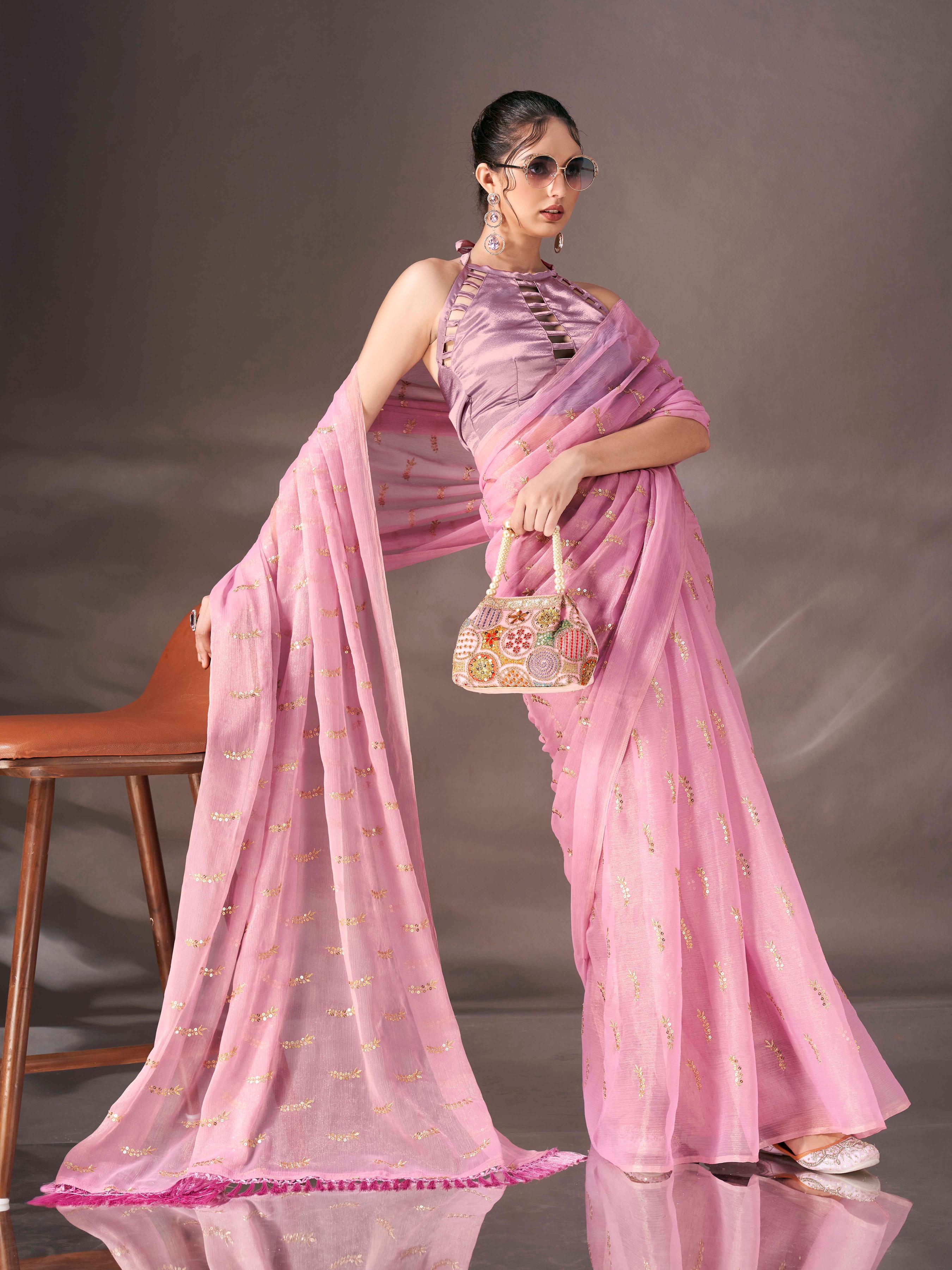 Pink colored sequin embroidered shimmer chiffon saree with tassles on pallu