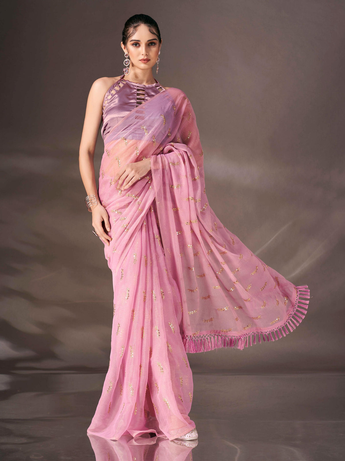 Pink colored sequin embroidered shimmer chiffon saree with tassles on pallu