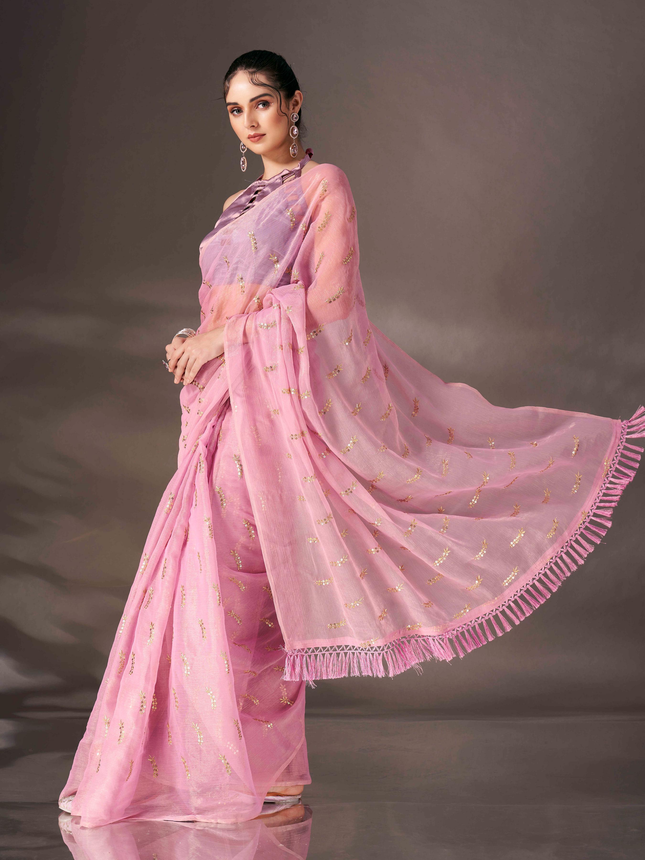 Pink colored sequin embroidered shimmer chiffon saree with tassles on pallu