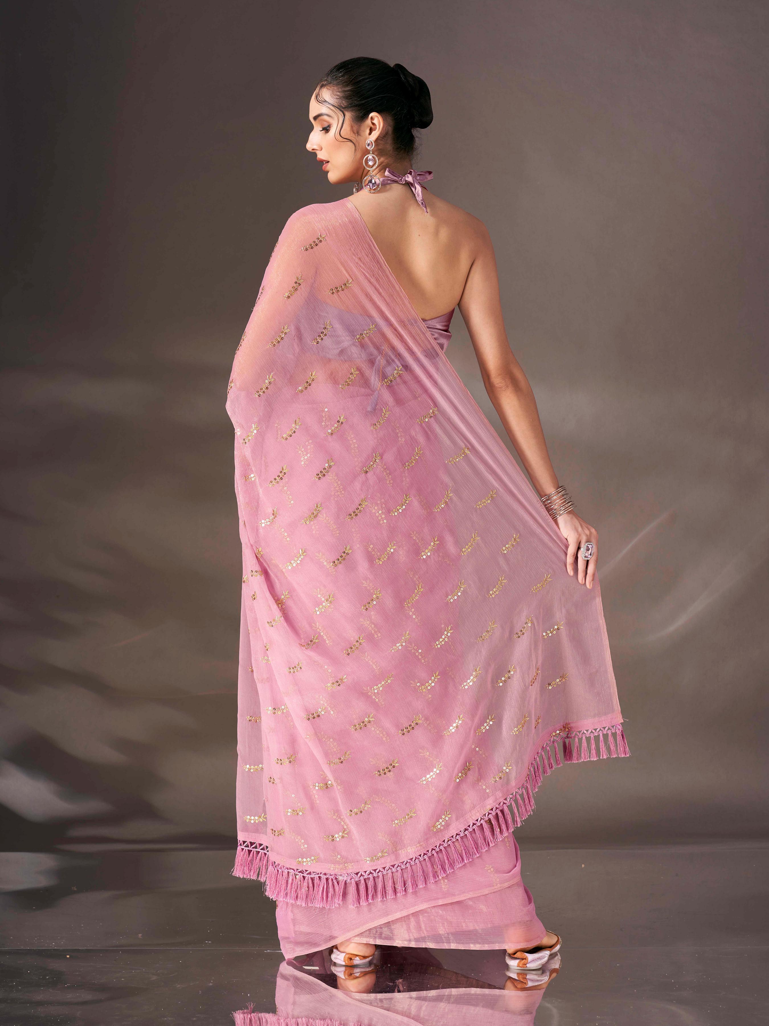 Pink colored sequin embroidered shimmer chiffon saree with tassles on pallu