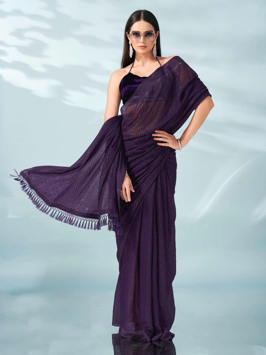 Purple colored lurex zari butti and satin border saree with tassles on palliu