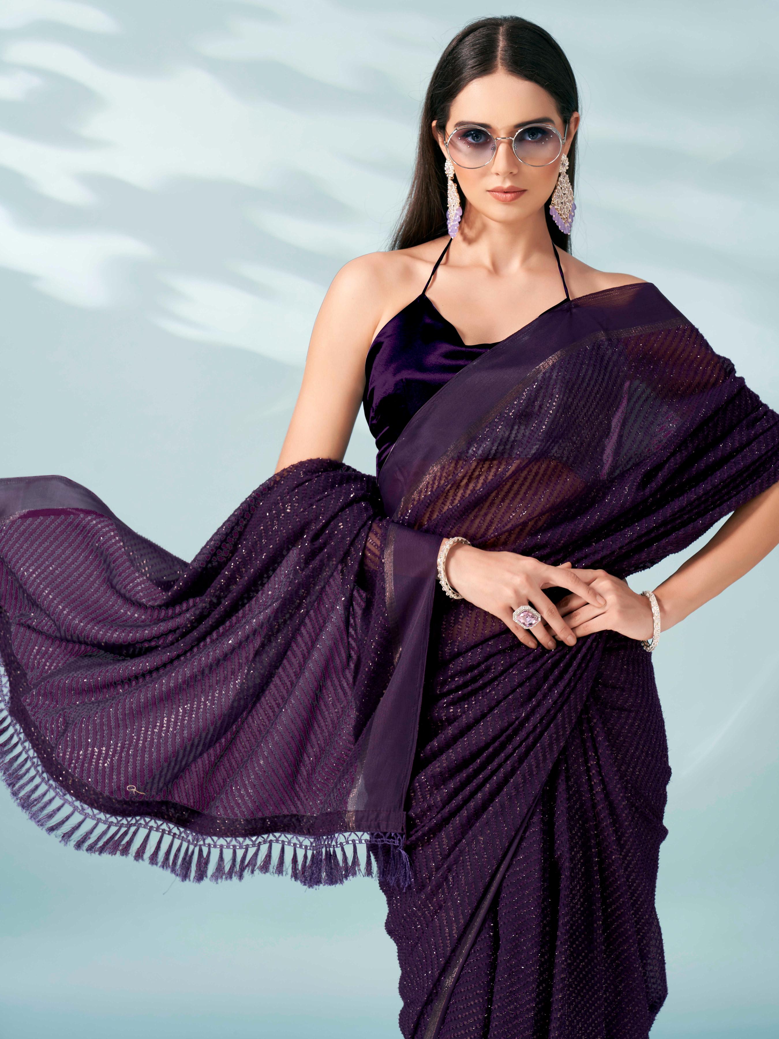 Purple colored lurex zari butti and satin border saree with tassles on palliu