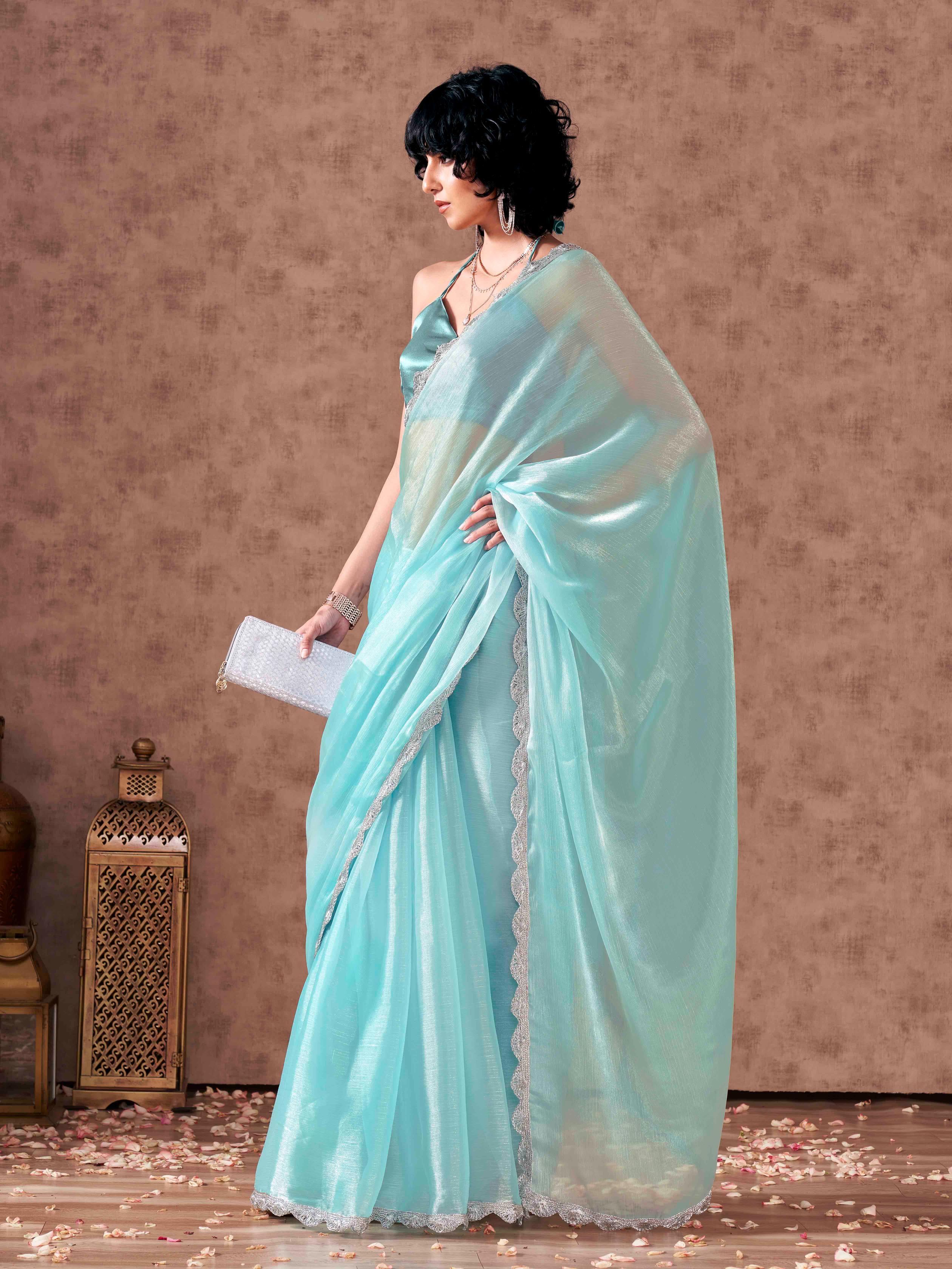 Blue colored shimmer chiffon saree with embellished lace and blouse