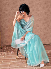 Blue colored shimmer chiffon saree with embellished lace and blouse