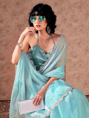 Blue colored shimmer chiffon saree with embellished lace and blouse