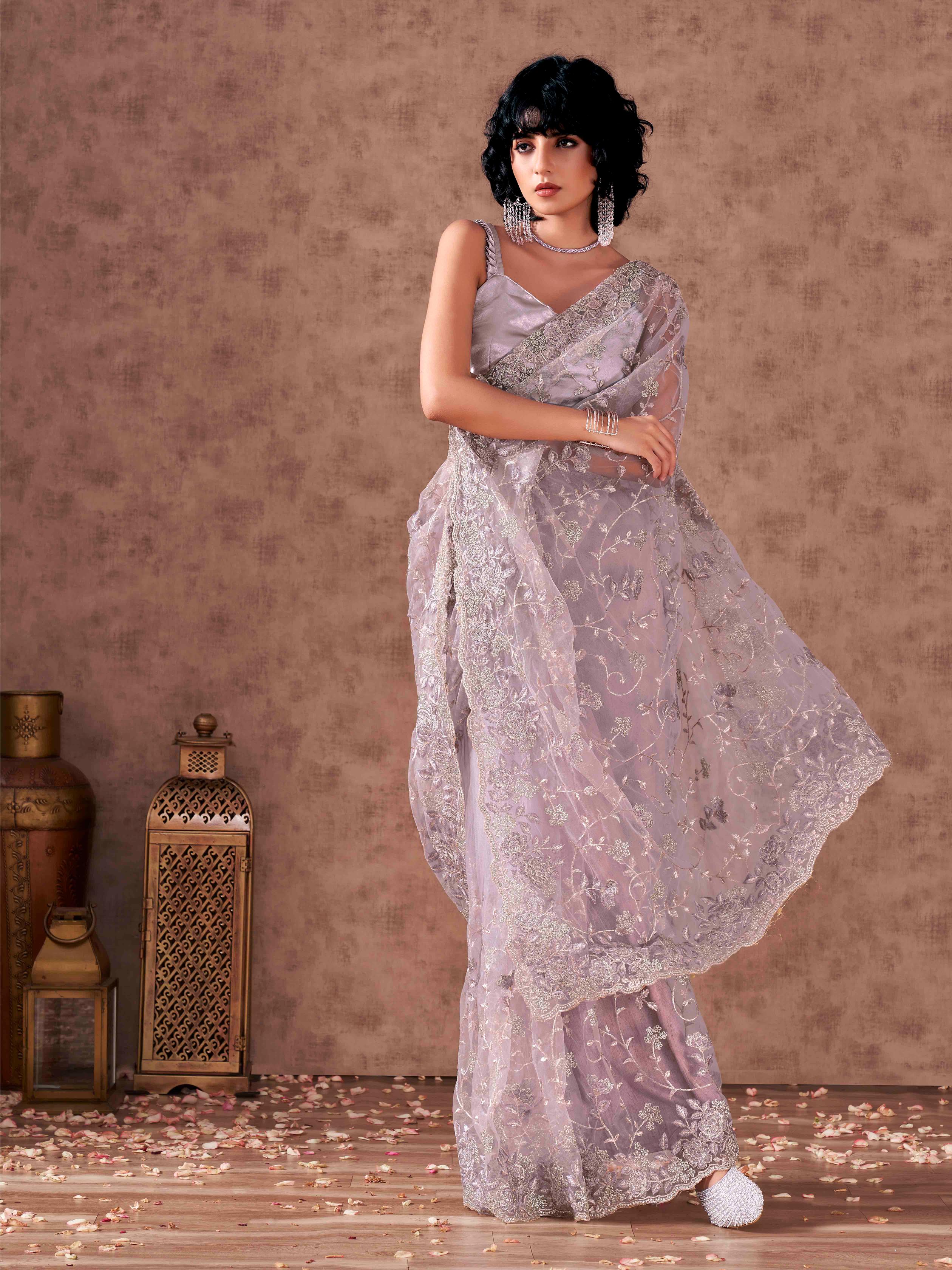 Mauve colored heavy embroidered net saree