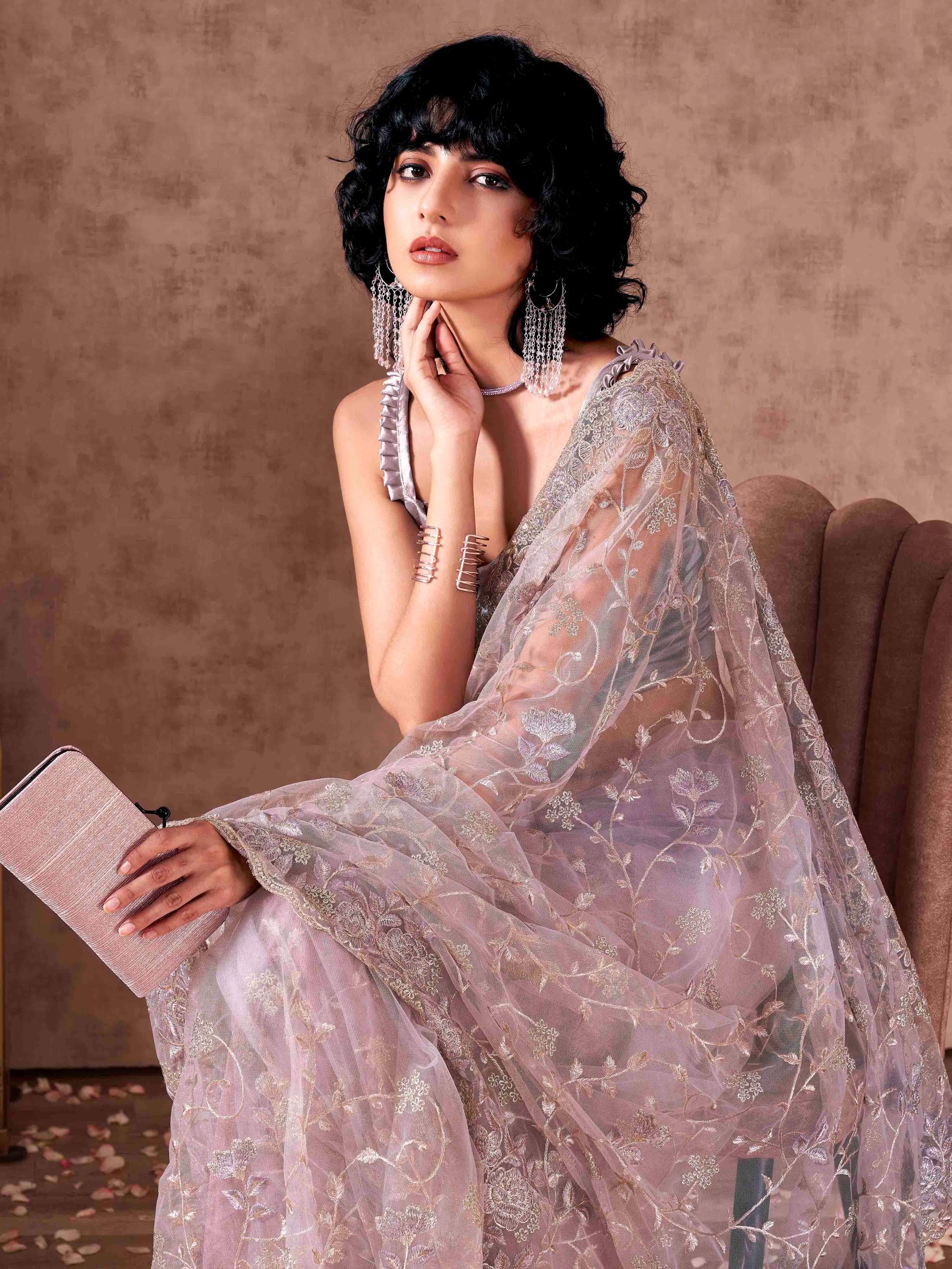 Mauve colored heavy embroidered net saree