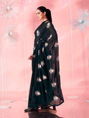 Black colored thread embroidered poly georgette saree with faux diamond along with crochet lace and embroidered blouse