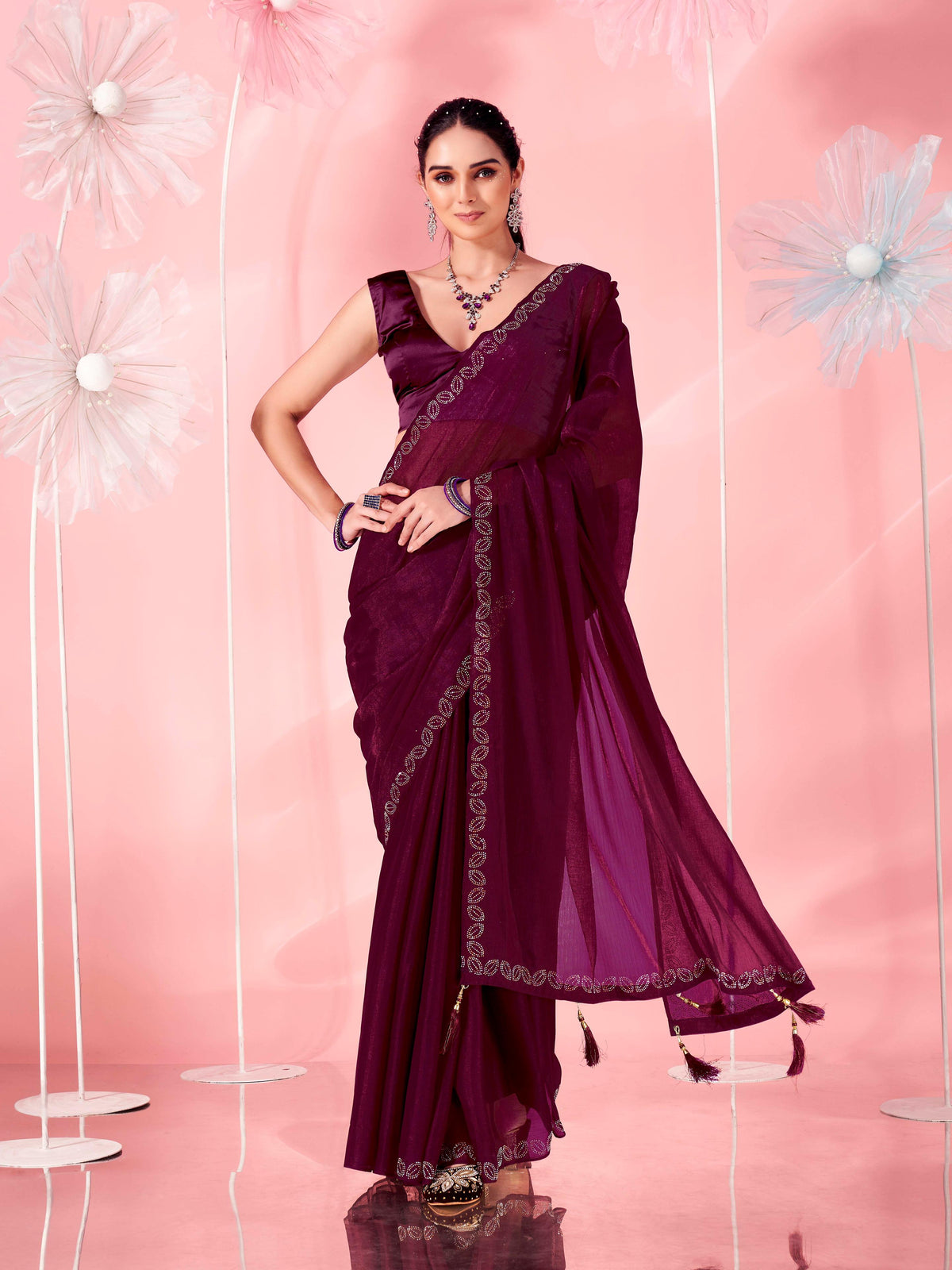 Magenta colored saree with faux diamond on border and tassles on pallu