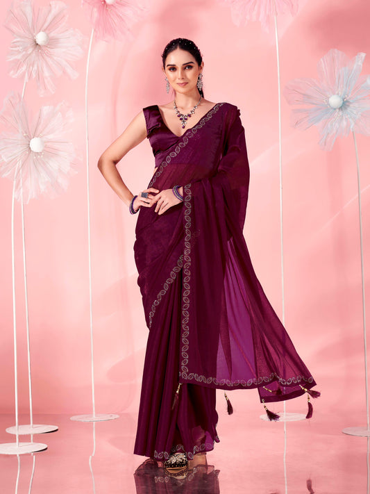 Magenta colored saree with faux diamond on border and tassles on pallu