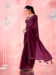 Magenta colored saree with faux diamond on border and tassles on pallu