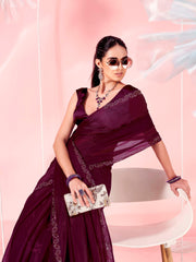 Magenta colored saree with faux diamond on border and tassles on pallu