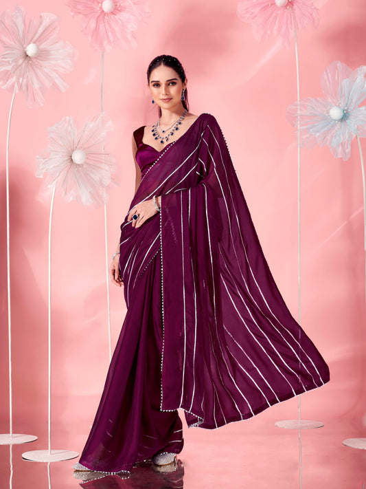 Magenta colored fancy embellished saree