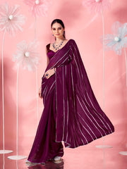 Magenta colored fancy embellished saree