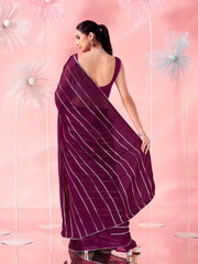 Magenta colored fancy embellished saree