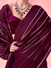 Magenta colored fancy embellished saree