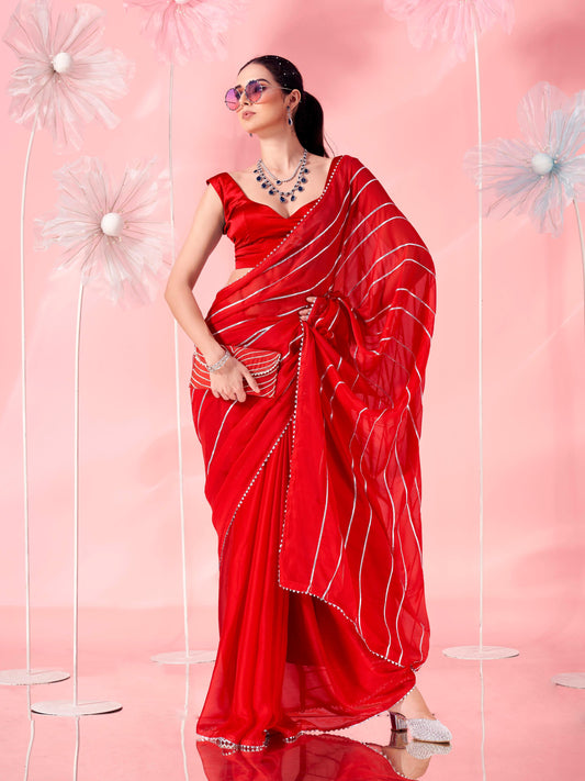 Red colored fancy embellished saree